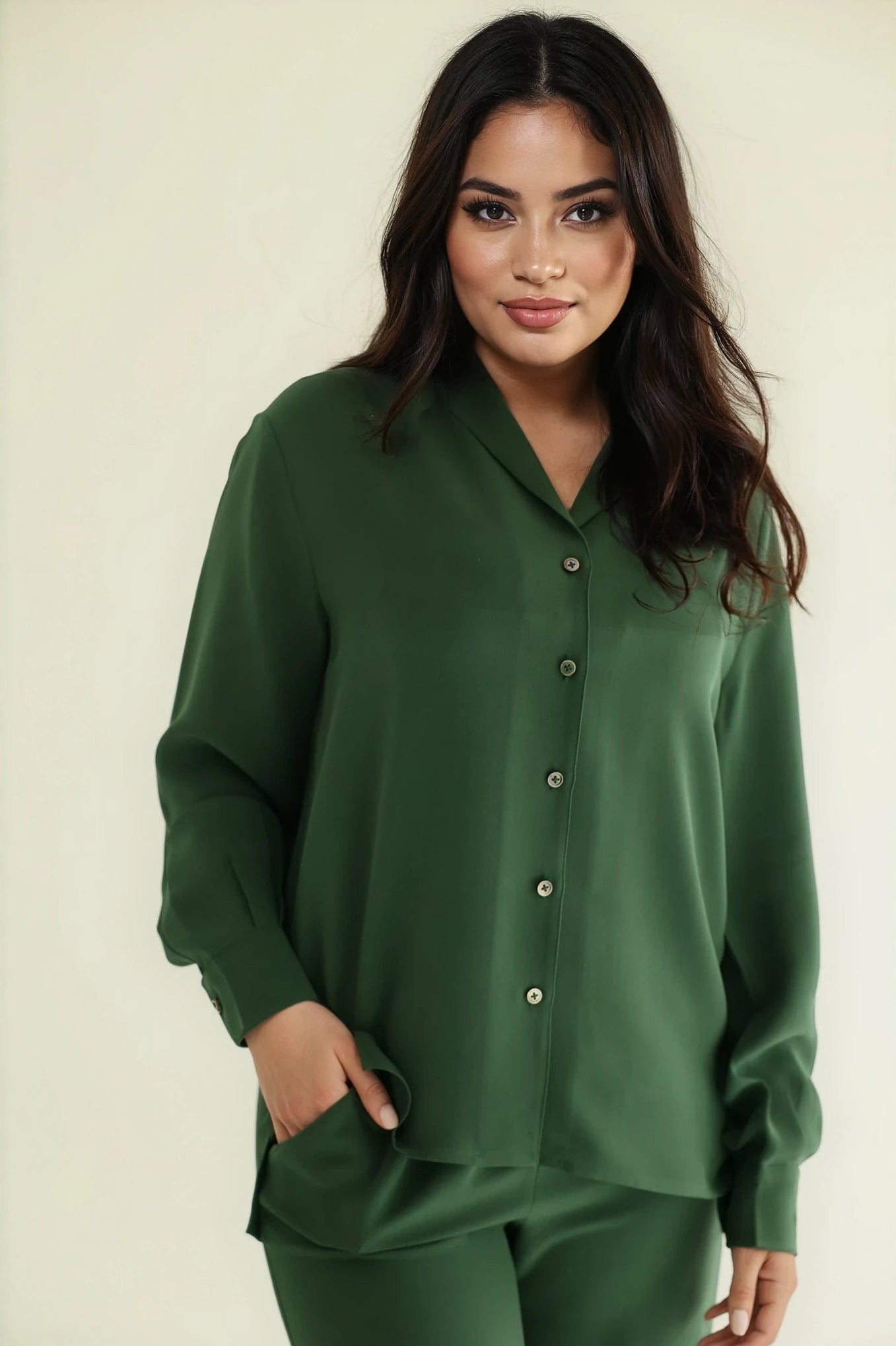 Model wearing Notto Silk emerald shirt.